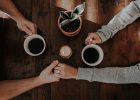 COUPLE HOLDING HANDS COFFEE